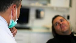 Patient shows dentist his teeth Stock Footage