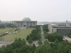 WS PAN View of National Assembly Building in Yeouido Island / Seoul, South Korea Stock Footage