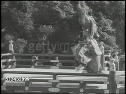 1946: TRADITIONAL JAPANESE THEATER: VS Traditional Japanese theater performed on outdoor stage (could be Noh, aka Nogaku musical drama), band playing music, various costumed performers on stage performing traditional dance. Entertainment, culture Instructional Video