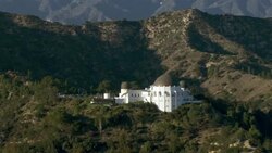 Aerial shot of the Griffith Observatory nestled in the Santa Monica Mountains in Los Angeles, California. Stock Footage