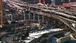 Traffic flows past a construction area of the Big Dig in Boston, Massachusetts. Stock Footage