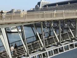 Passerelle Leopold-Sedar-Senghor bridge over River Seine next to Musee d'Orsay, Paris, France Stock Footage