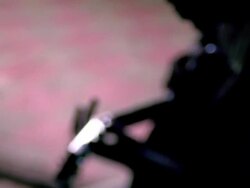 Selective focus tilt down silhouettes of Black woman behind Black man playing guitar / Nova Scotia Stock Footage