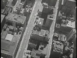 The Empire State Building overlooks New York City streets. News Clip