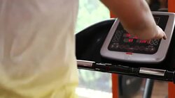Young man running on treadmill Stock Footage