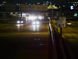 Night time lapse traffic traveling toward and away from camera down an interstate highway. Stock Footage
