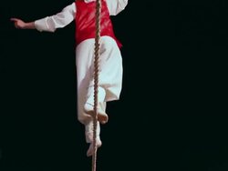 CU TS LA Shot of tightrope walker doing acrobatics on high wire at night / Gyeonggido, South Korea Stock Footage