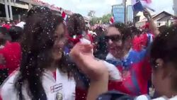 Costa Rica fans celebrate after their football team beat Italy at the World Cup News Clip