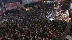 A huge crowd congests the streets as a parade slowly proceeds during India's Diwali festival. Stock Footage
