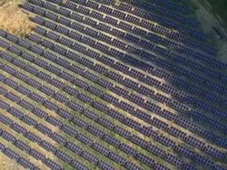 MS AERIAL View of solar power plant through nature / Siena, Tuscany, Italy Stock Footage