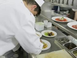 POV food being prepared at the hot plating area in a restaurant kitchen Stock Footage
