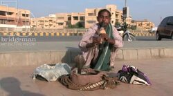 Snake Charmer on Clifton Beach, Karachi 1 Stock Footage