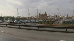 Traffic passing Valetta harbour area News Clip