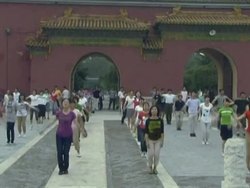 VOICED: All together now! Beijing revives mass exercises News Clip