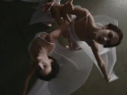 above view of ballerinas linking arms and spinning Stock Footage