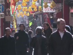 MS Pedestrians walking down a crowded, narrow street past local businesses / Yokohama, Kanagawa Prefecture, Japan Stock Footage