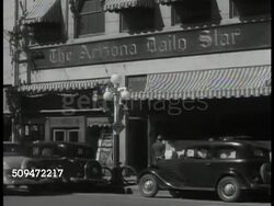1935: ARIZONA: DAILY STAR: WS Tucson landscape, cactuses. MS 'Arizona Daily Star' shop, traffic FG. INT MS Editor William R. Matthews (unconfirmed) typing at desk. VS CU Newspaper '...Taxpayers Aid...; Mexico Facing Serious Politico-Economic Crisis.' Instructional Video