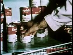 A chef removes cans of soup from a kitchen shelf. News Clip