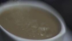 SLO MO CLOSE-UP SELECTIVE FOCUS Sugar pouring into coffee Stock Footage