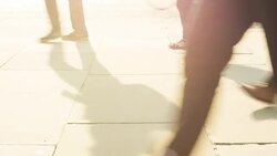 Side view of commuters walking past the camera Stock Footage
