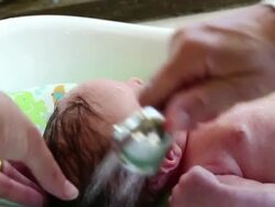 MS Shot of mother giving baby bath / Lamy, New Mexico, United States Stock Footage
