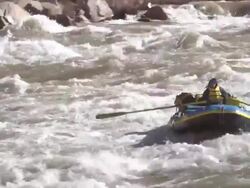 WS PAN Females in blue raft moving down rapid and raft floating on side way / Grand Canyon, Arizona, USA Stock Footage