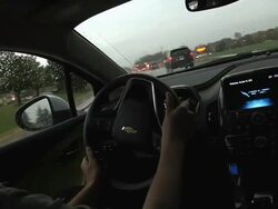 MS POV Driver maneuvering through city traffic in electric car / Rochester, Michigan, United States Stock Footage