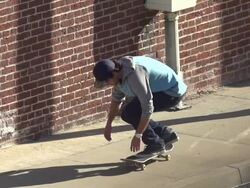A young man skateboarding on the sidewalk.  - Slow Motion - filmed at 240 fps Stock Footage