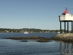 Small boats and a lighthouse Stock Footage
