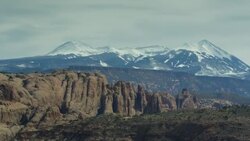 Wide panning shot of mountain range landscape / Moab, Utah, United States Stock Footage