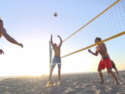 Men playing beach volleyball. - Slow Motion - filmed at 240 fps Stock Footage