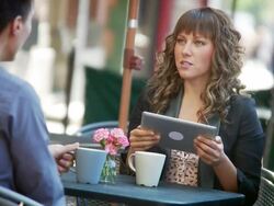 Couple have coffee at outdoor cafe Stock Footage