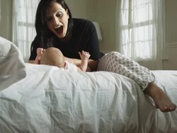 mother and baby on a bed Stock Footage