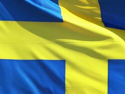 CU SLO MO Shot of Sweden flag waving in wind / Caen, Normandy, France Stock Footage