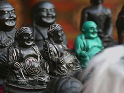 MS Shot of Buddha figurines sit on table for sale at Merchant shop in Namche Bazarre / Namche, Nepal Stock Footage