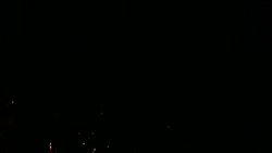 A dark sky is illuminated with flashing fireworks. Stock Footage