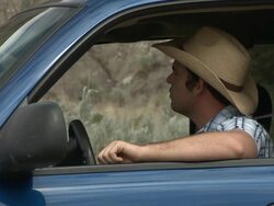 Cowboy picks up businessman hitch hiker Stock Footage