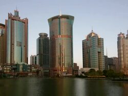 Time lapse long shot view across Huangpu River of Pudong financial district / day to night / Shanghai Stock Footage