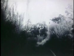 1950s B/W MONTAGE Viet Cong soldiers running down railroad as sabotaged bridge explodes / Vietnam  Stock Footage