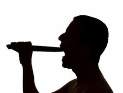 HD: Silhouette of Eating A Knife Stock Footage