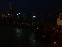 WS PAN People praying in ganges river bank at night / Haridwar, Uttarakhand, India Stock Footage