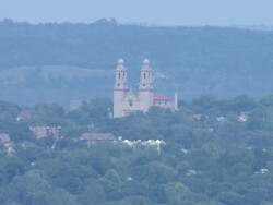 Zoom from CU to WS of St. Cecilia's Catholic Church with twin spires Stock Footage
