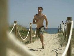 High Speed Man running along sandy path, Spain, pan right. Stock Footage
