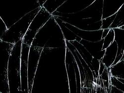 Hammer breaking pane of glass, slow motion Stock Footage