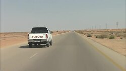 Driving Into Sirte Past Burnt Out Cars News Clip