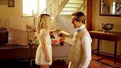 Flower girl helping groom get ready before wedding Stock Footage