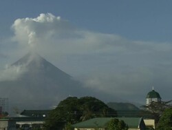 Mayon volcano spews ash and steam over Legazpi city, Philippines, Philippines, Dec 2009 Stock Footage
