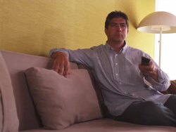 MS Man on couch, using TV remote / Portland, Oregon, United States Stock Footage