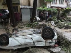 Smashed and overturned vehicles after the devastating flooding in Varna, Bulgaria Stock Footage