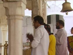 MS ZI ZO People praying and bell ringing in Hindu temple / Haridwar, Uttarakhand, India Stock Footage